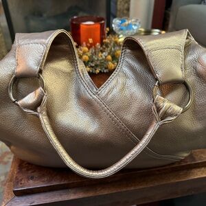 Golden bronze color in very good used condition. 14” w X 8” h x 3” d.